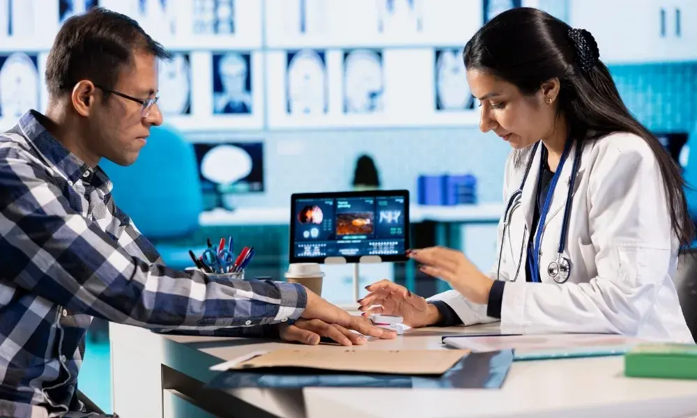 A doctor talking to a patient in a multi-specialty clinic setting