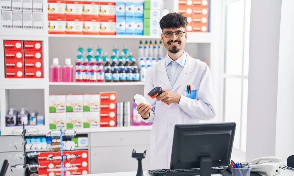 A pharmacist professionally dispensing medicine in a medical setting